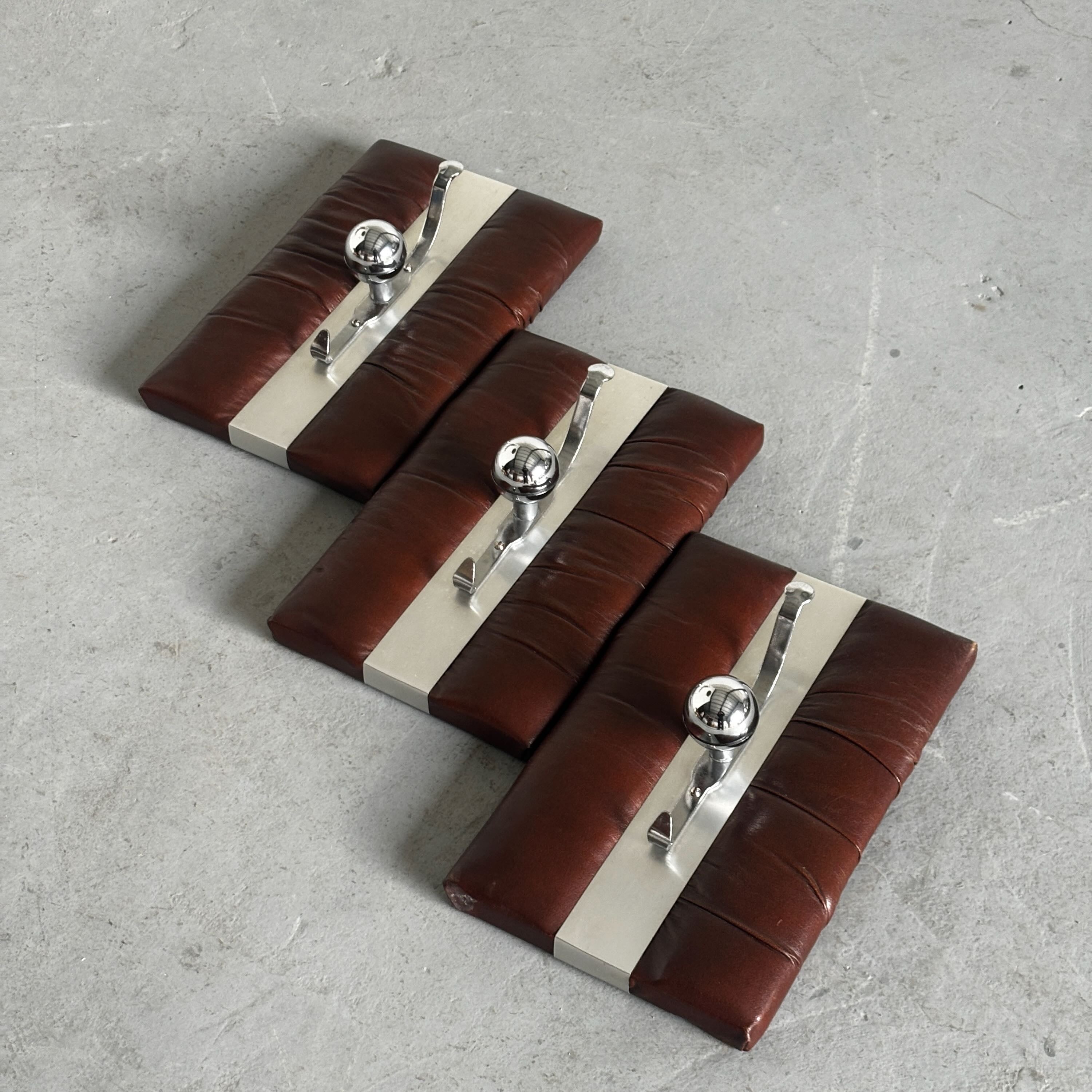 Wall-Mounted Coat Racks in Chrome and Leather