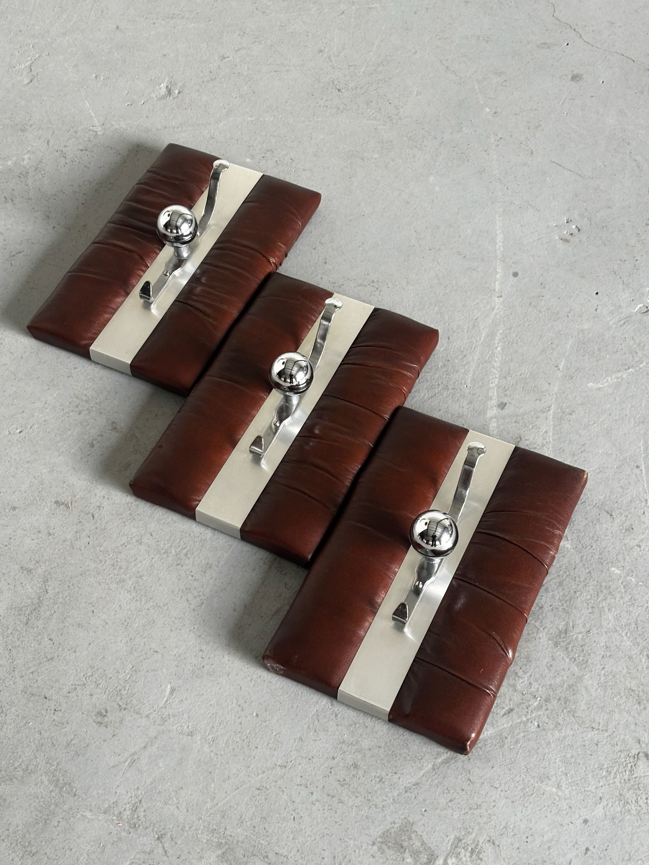 Wall-Mounted Coat Racks in Chrome and Leather