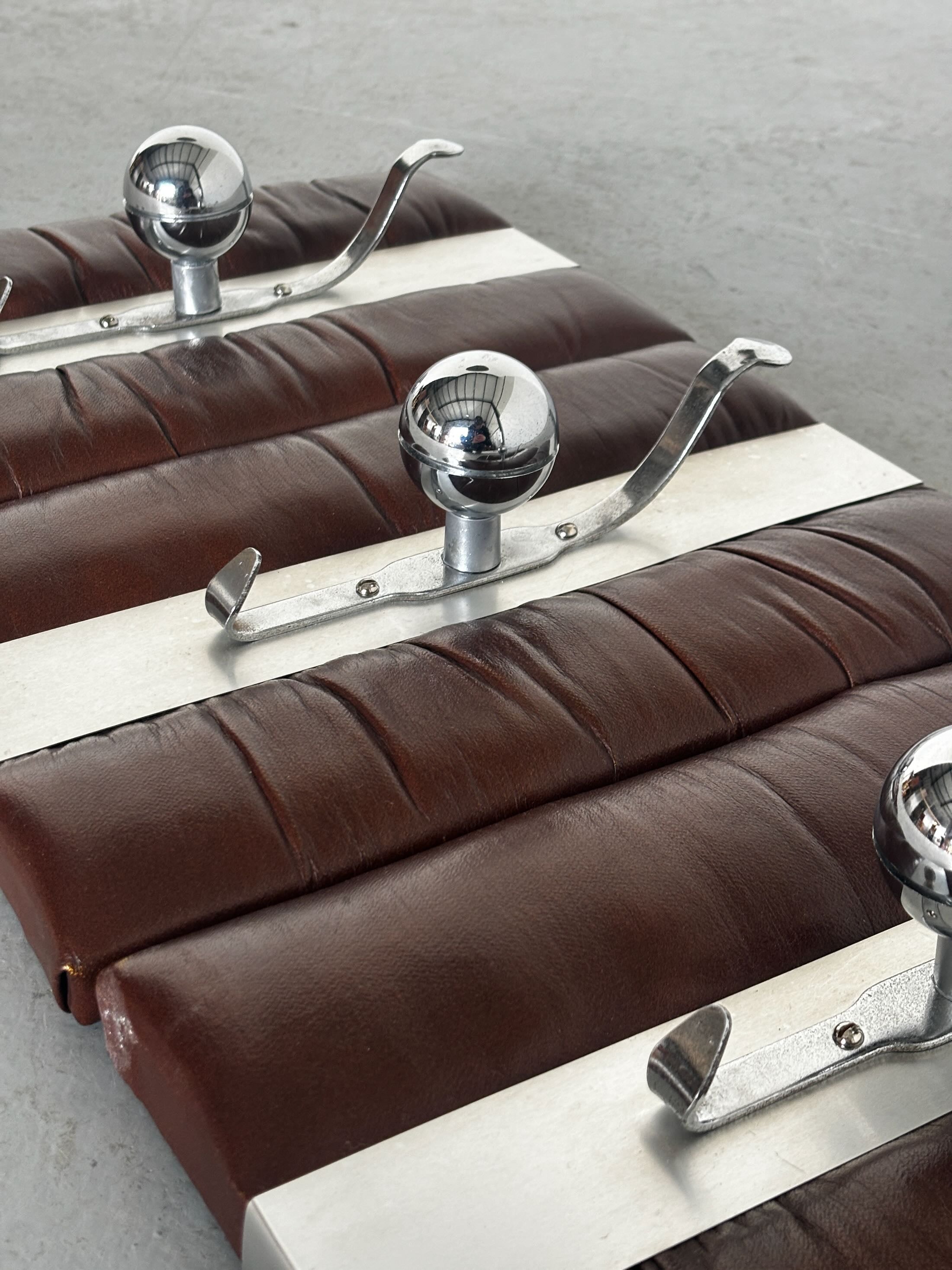 Wall-Mounted Coat Racks in Chrome and Leather