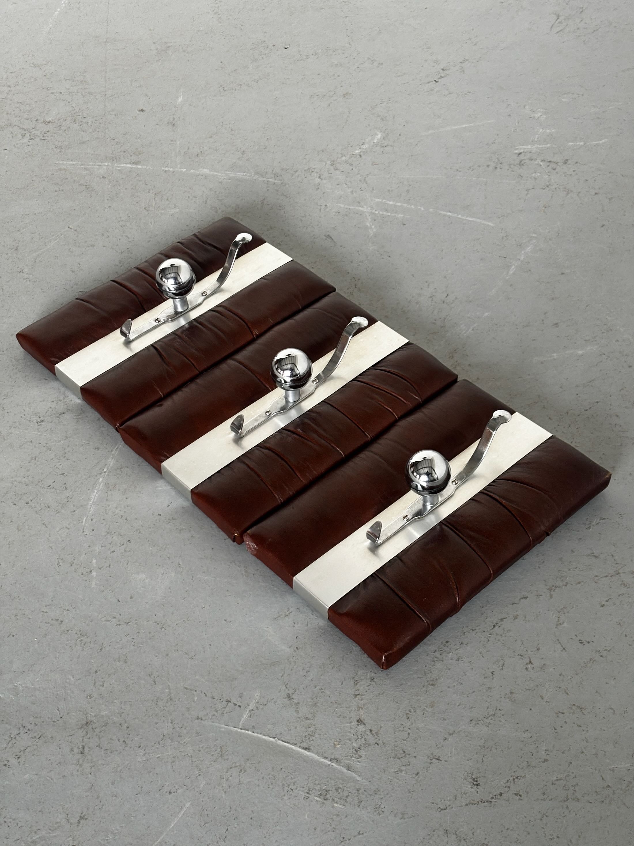 Wall-Mounted Coat Racks in Chrome and Leather