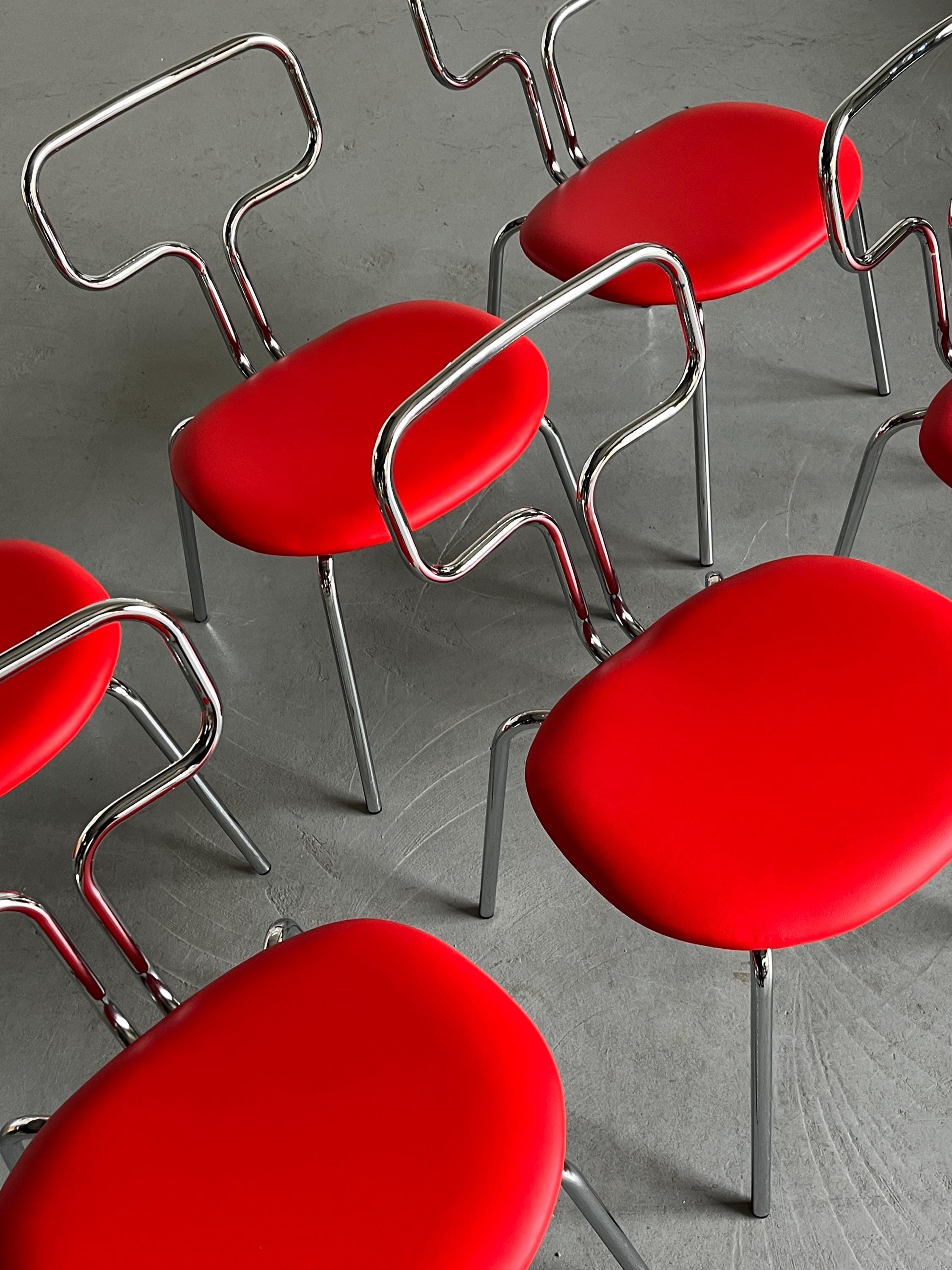 Curved Chrome Tubular Steel and Faux Leather Dining Chairs