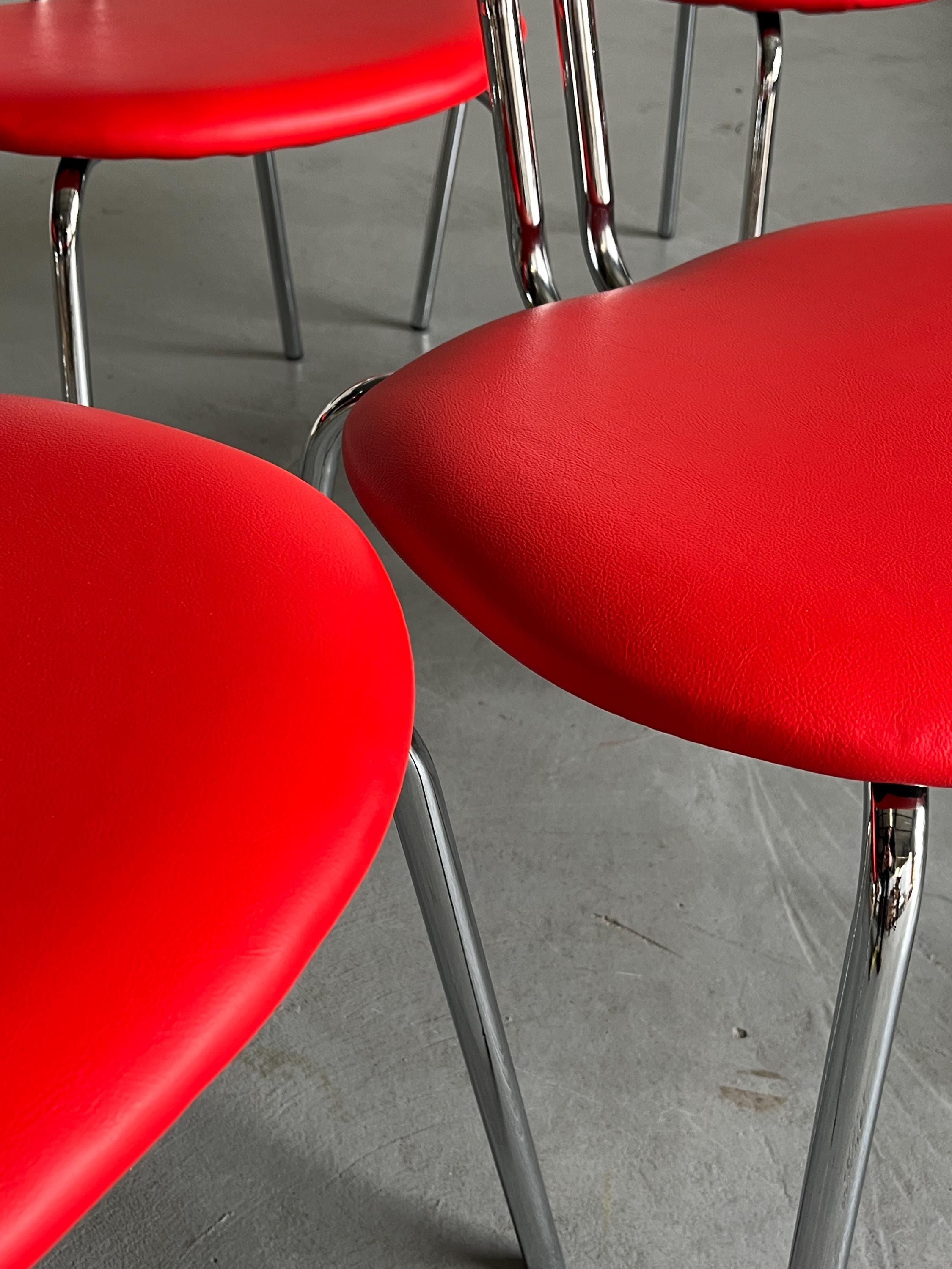 Curved Chrome Tubular Steel and Faux Leather Dining Chairs