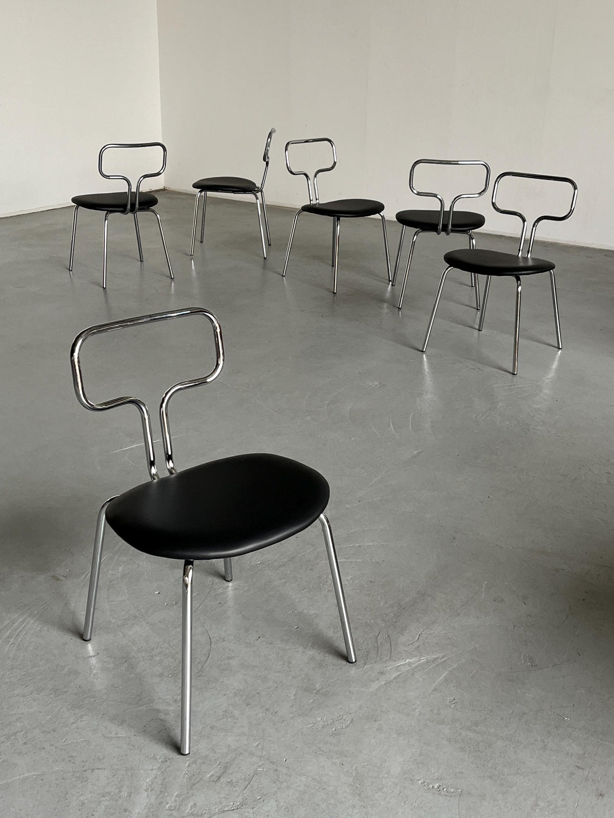 Curved Chrome Tubular Steel and Faux Leather Dining Chairs