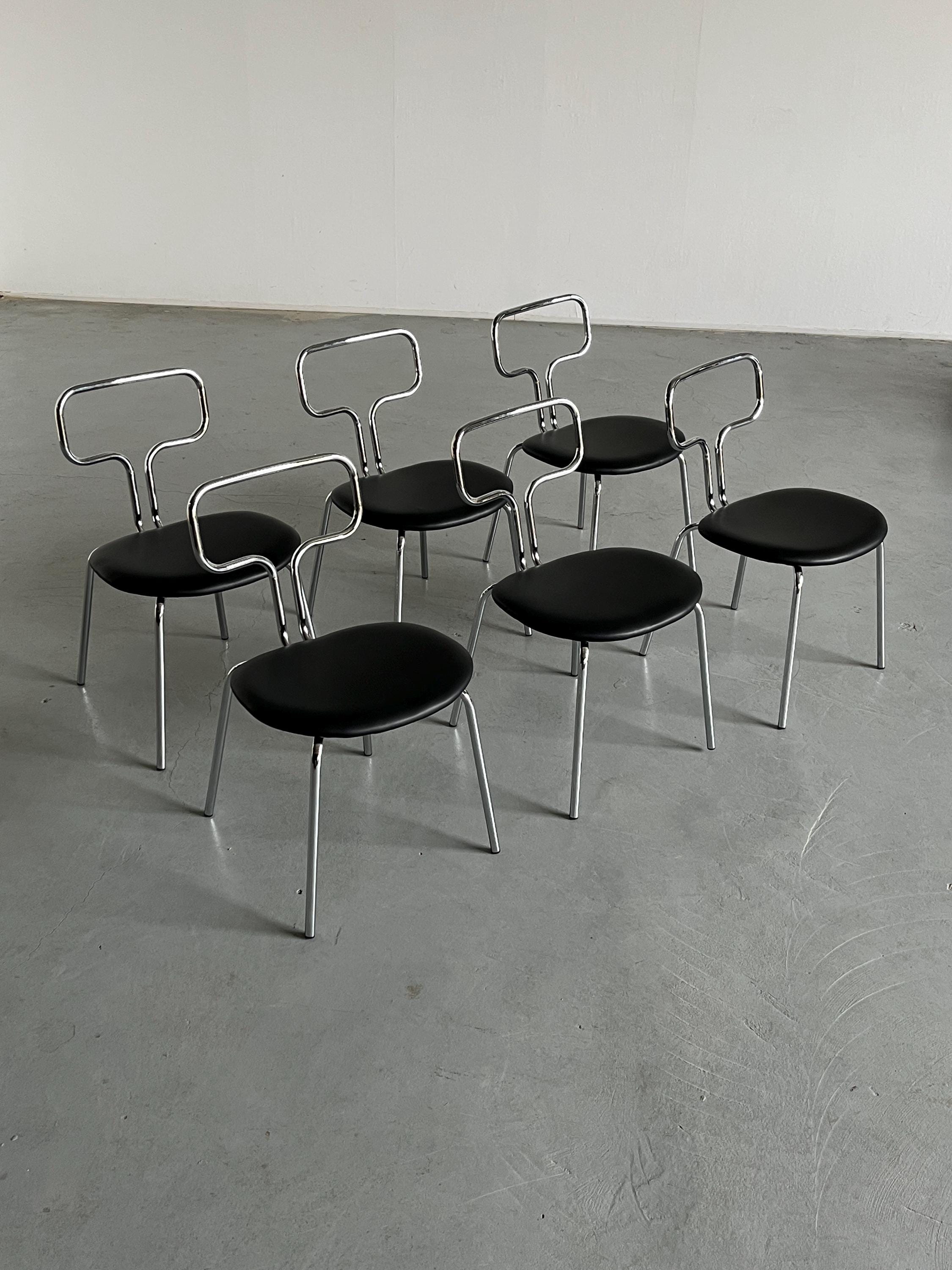 Curved Chrome Tubular Steel and Faux Leather Dining Chairs