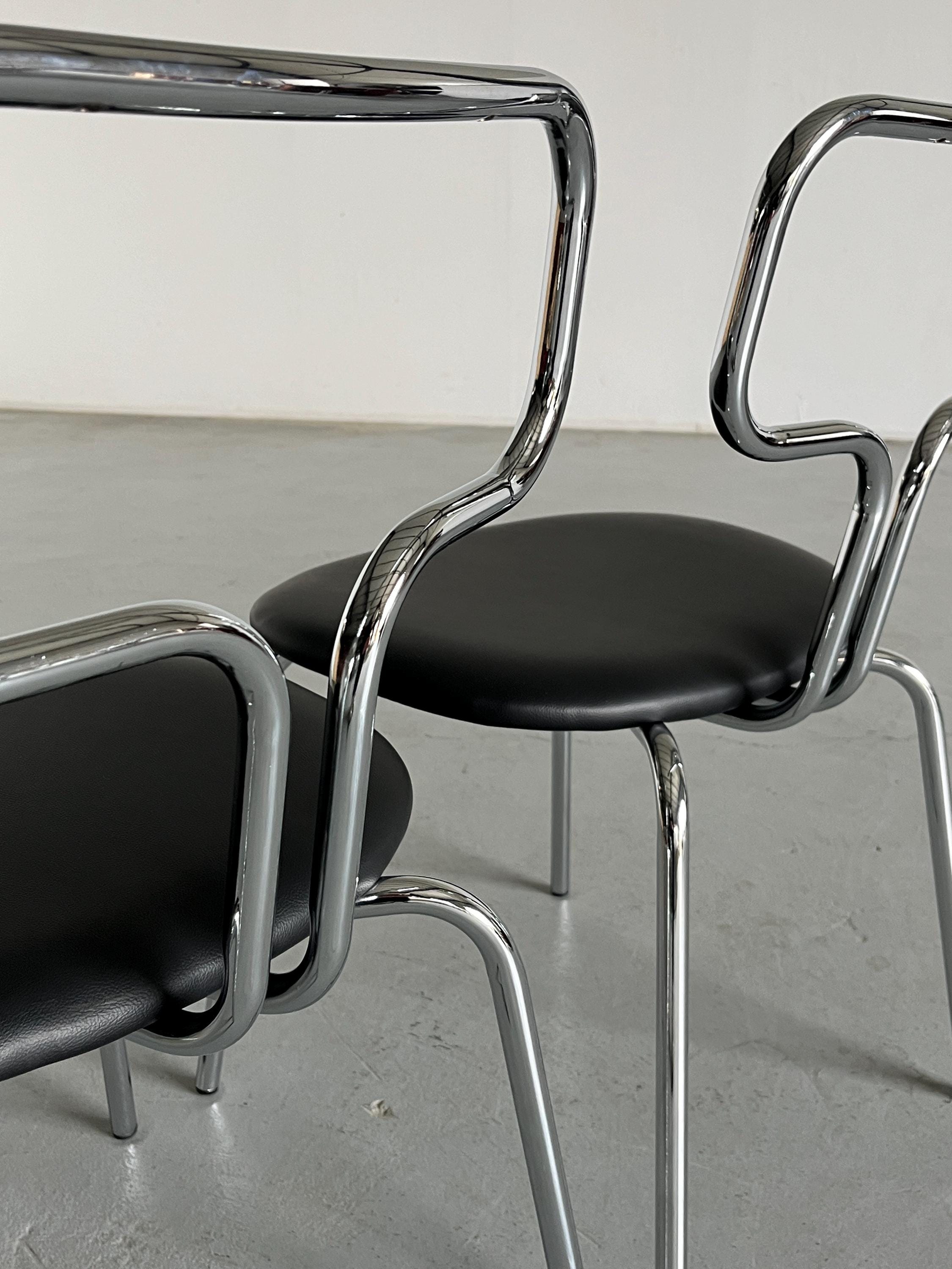 Curved Chrome Tubular Steel and Faux Leather Dining Chairs