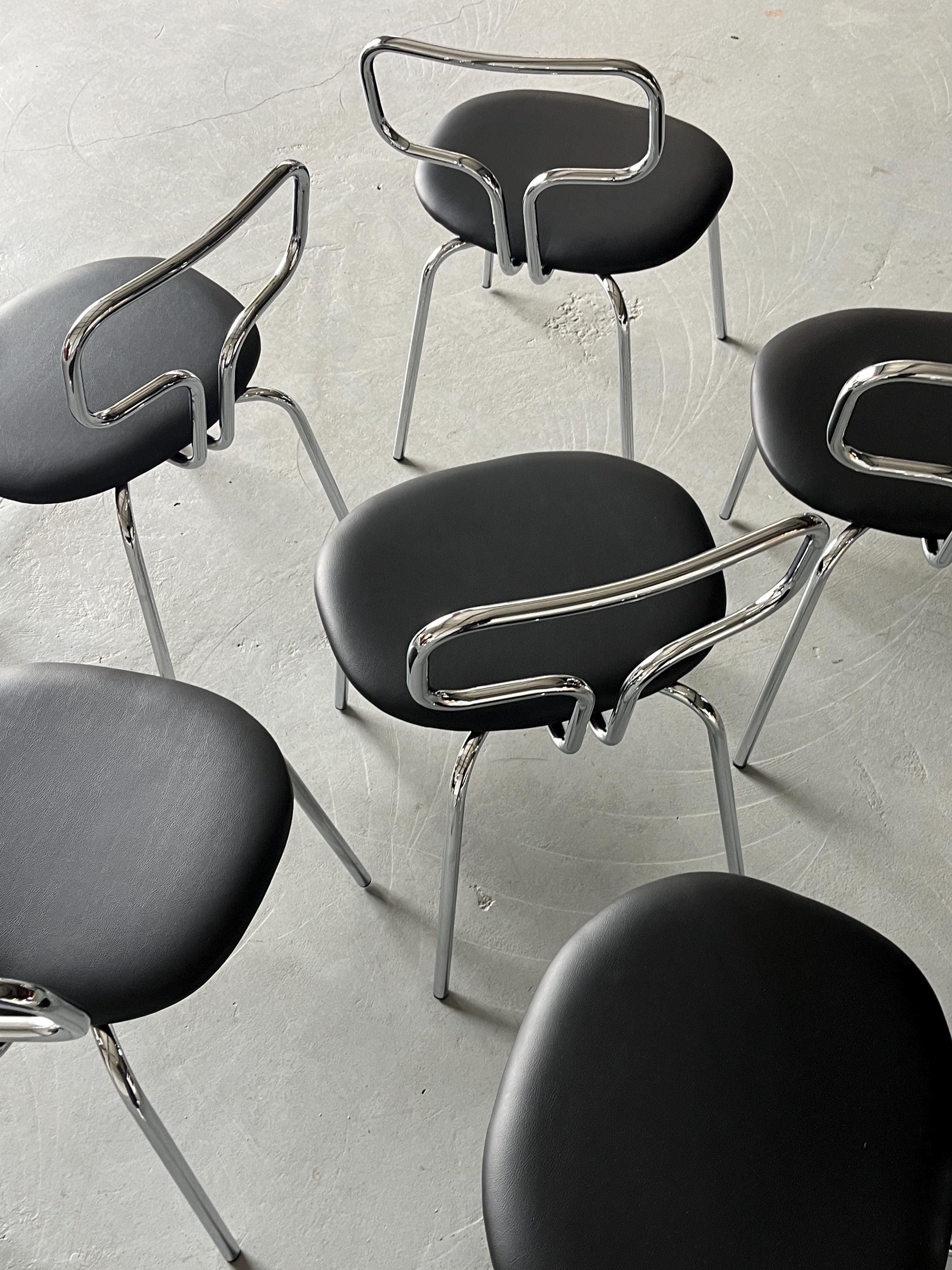 Curved Chrome Tubular Steel and Faux Leather Dining Chairs