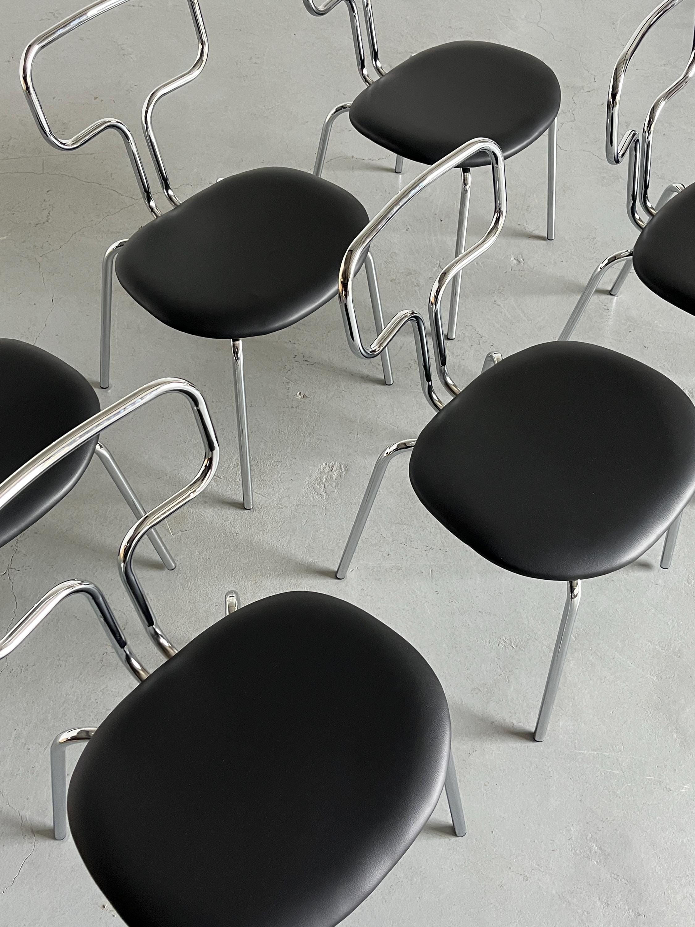 Curved Chrome Tubular Steel and Faux Leather Dining Chairs