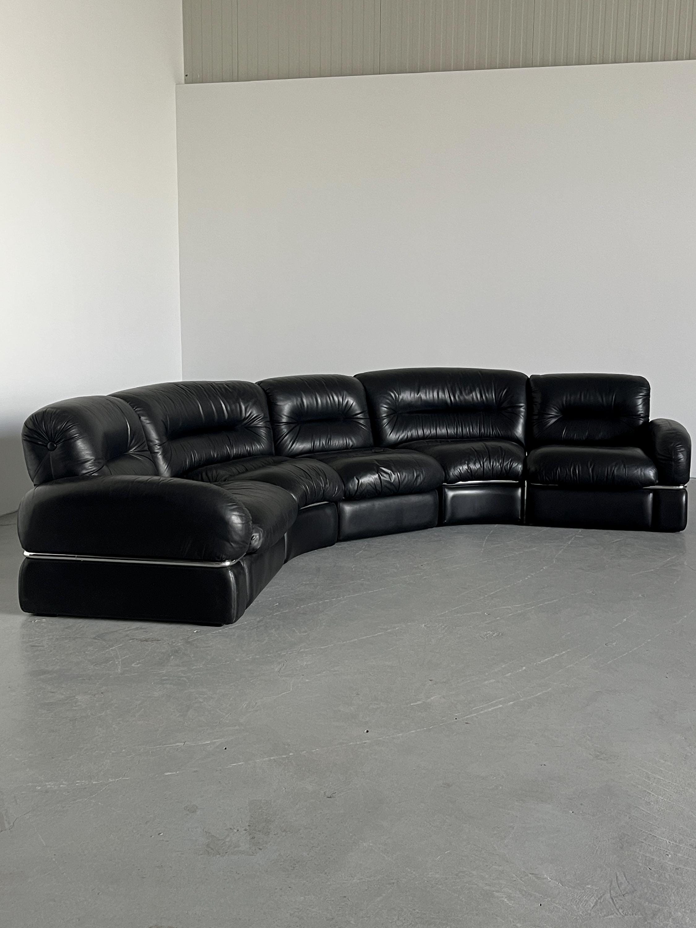 Elegant Italian Curved Leather Sofa with Chromed Frame