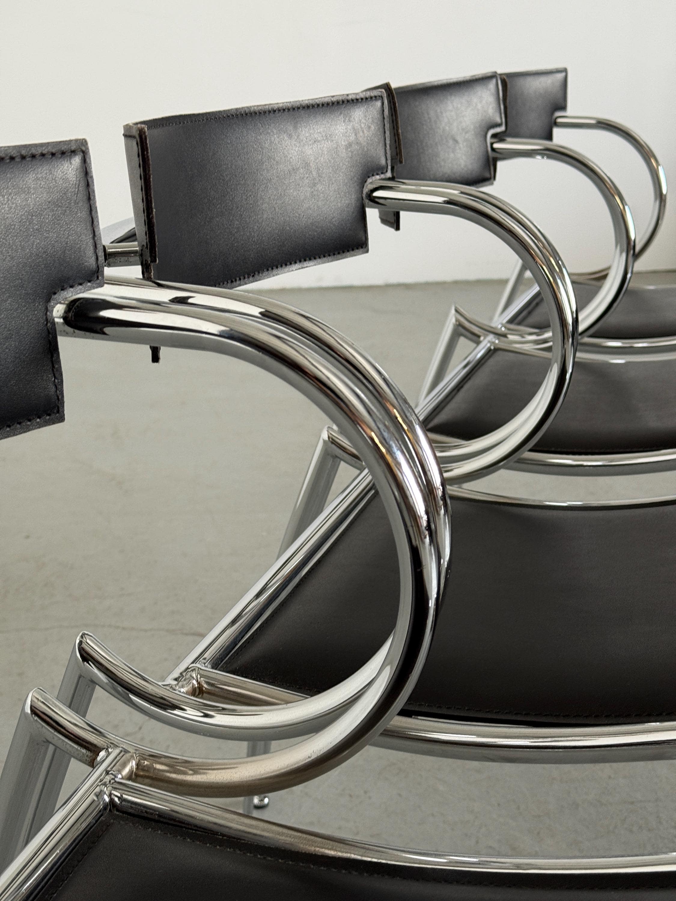 Curved Chrome and Black Leather Dining Chairs