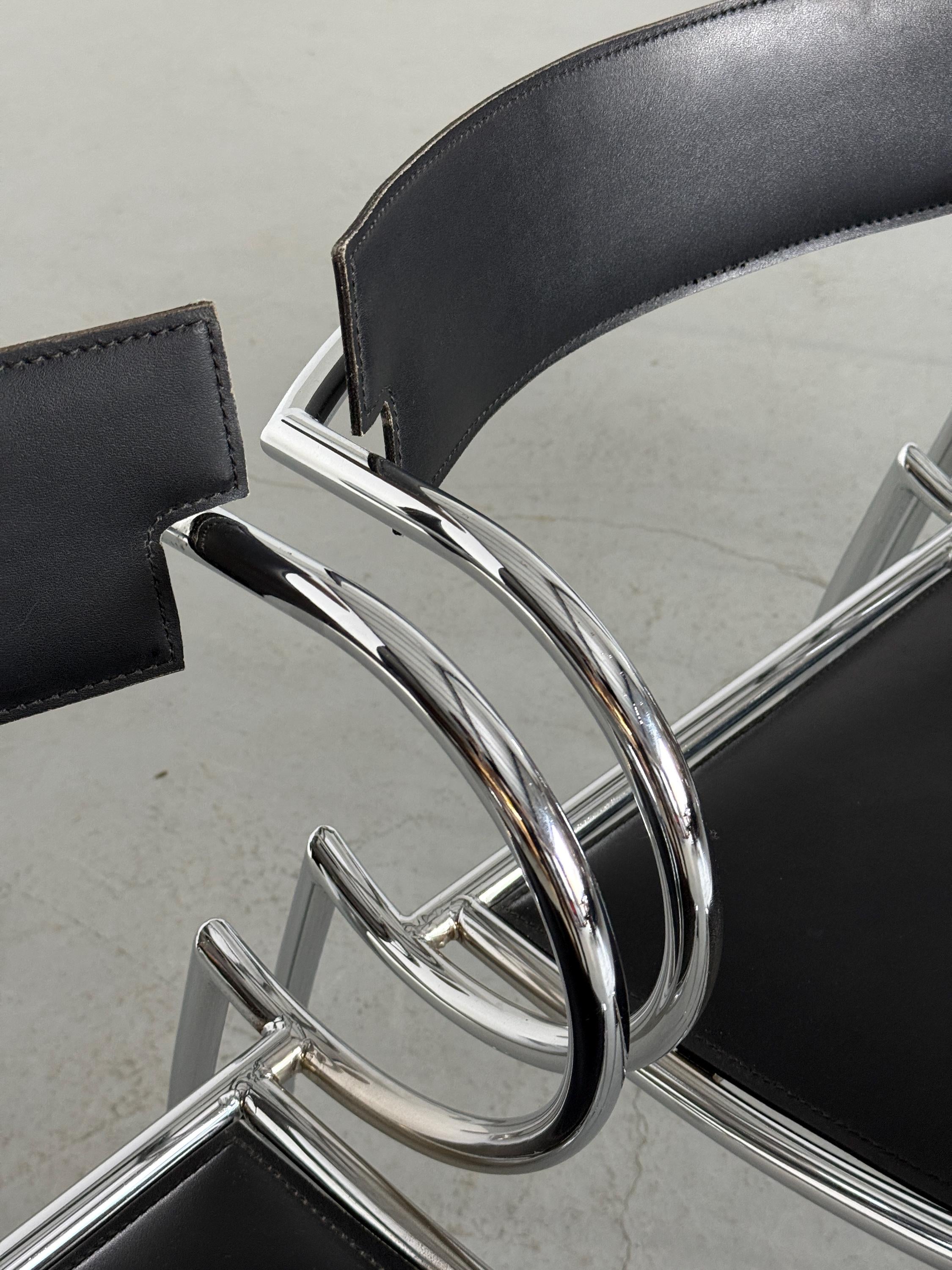 Curved Chrome and Black Leather Dining Chairs