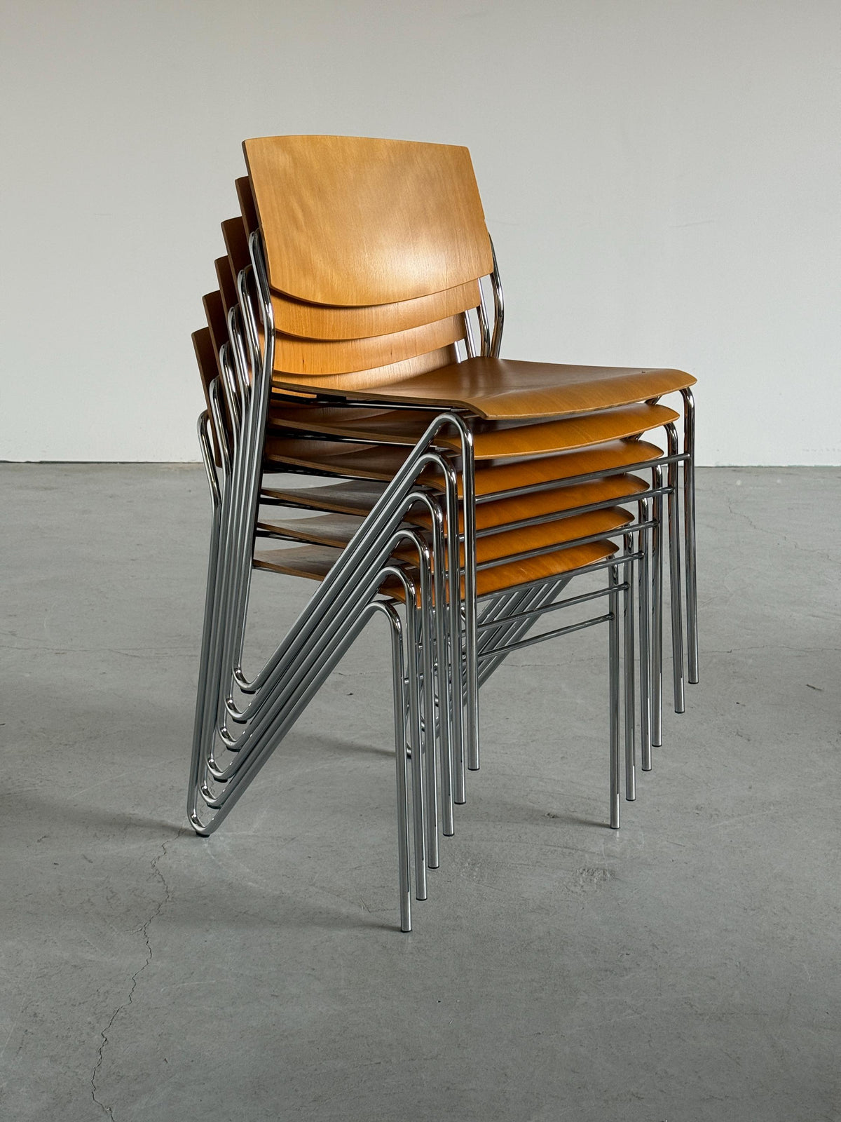 Chrome and Beech Plywood Stacking Chairs