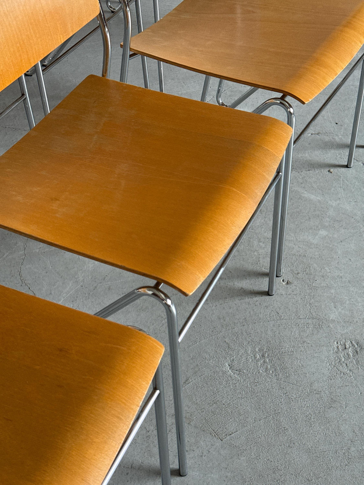 Chrome and Beech Plywood Stacking Chairs