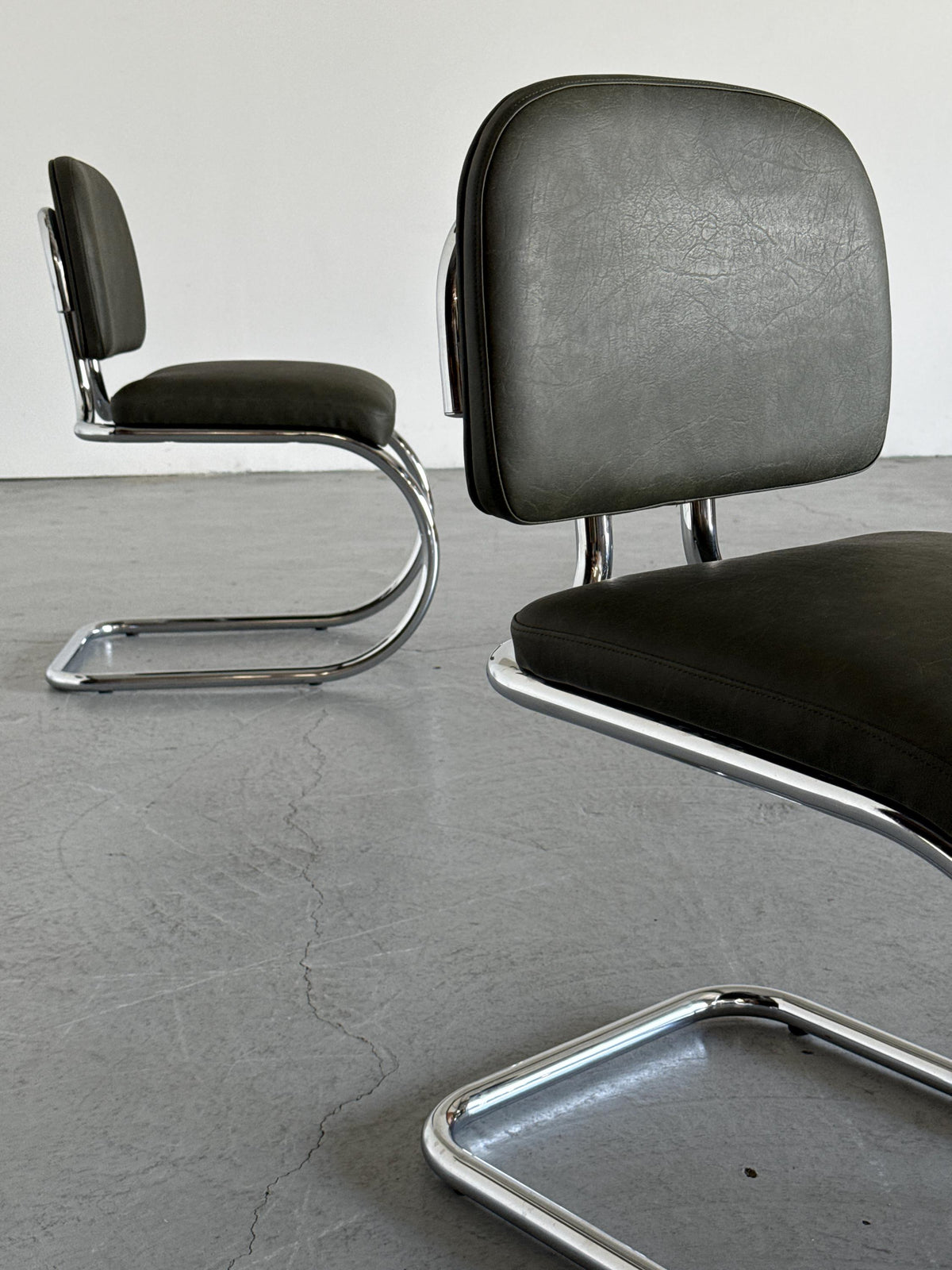 Faded Green Faux Leather Cantilever Chair