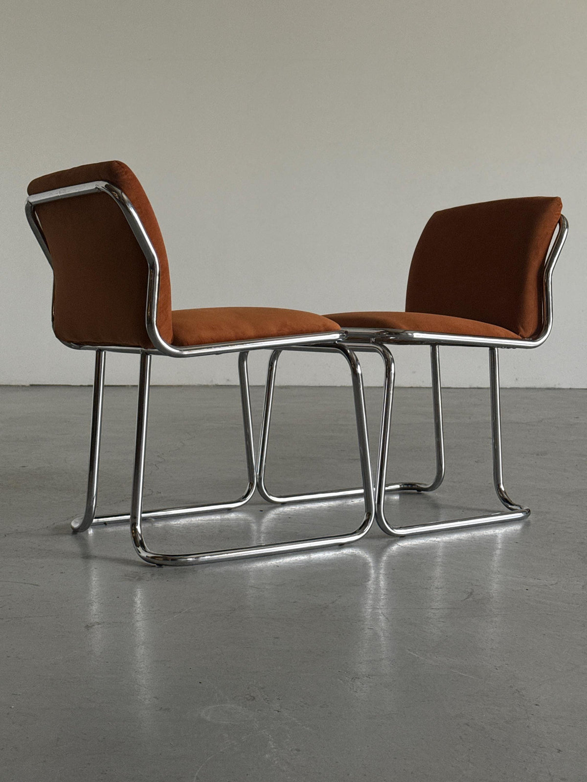 Chrome Loop Chairs with Rust Orange Upholstery