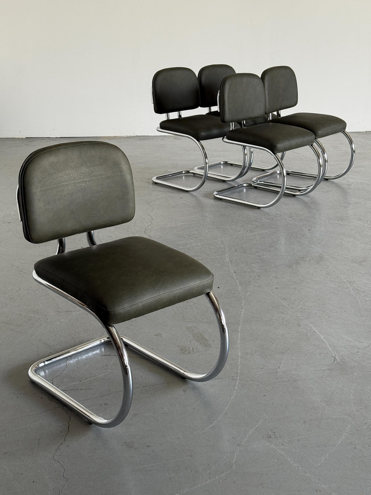 Faded Green Faux Leather Cantilever Chair