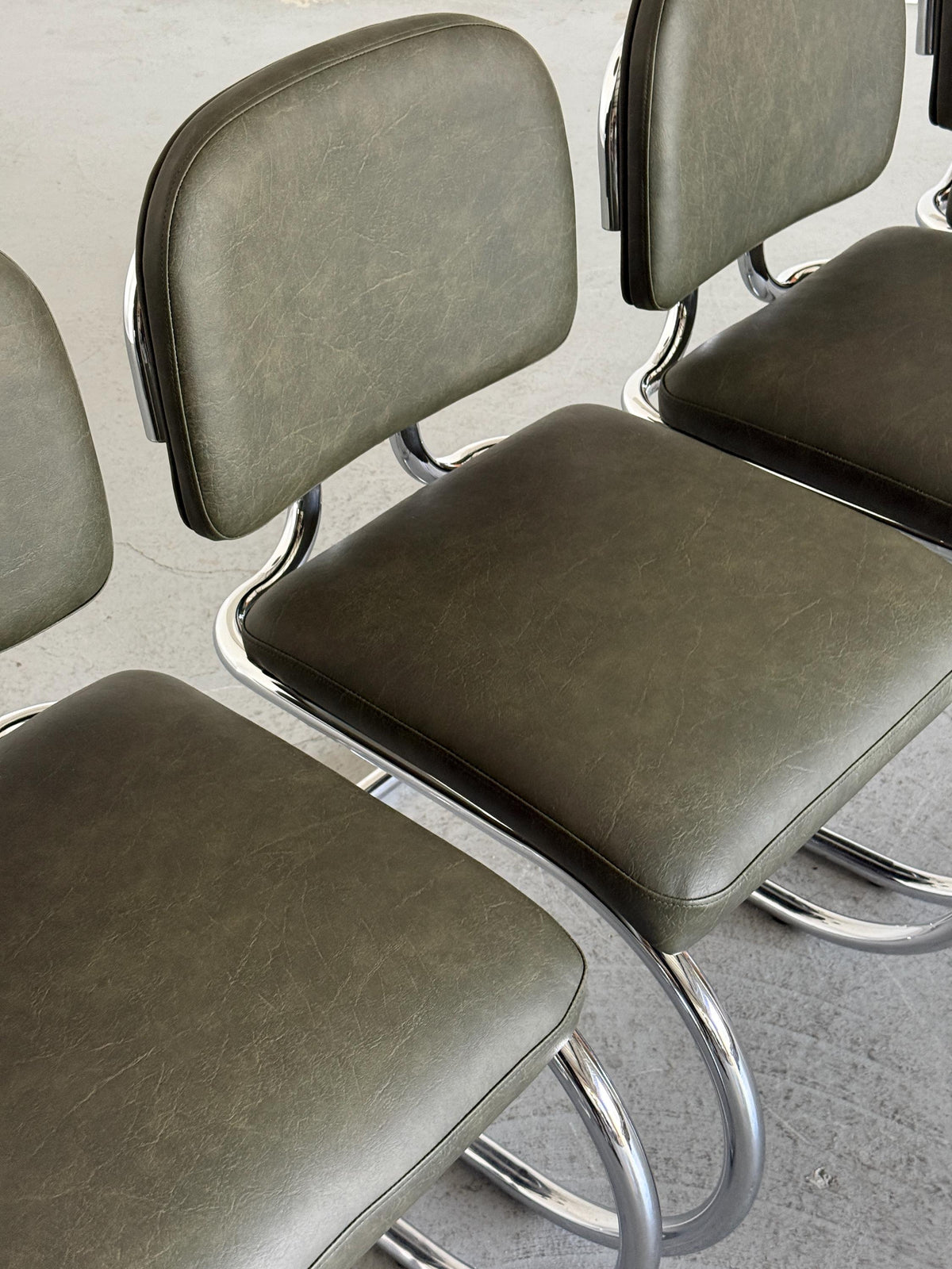 Faded Green Faux Leather Cantilever Chair
