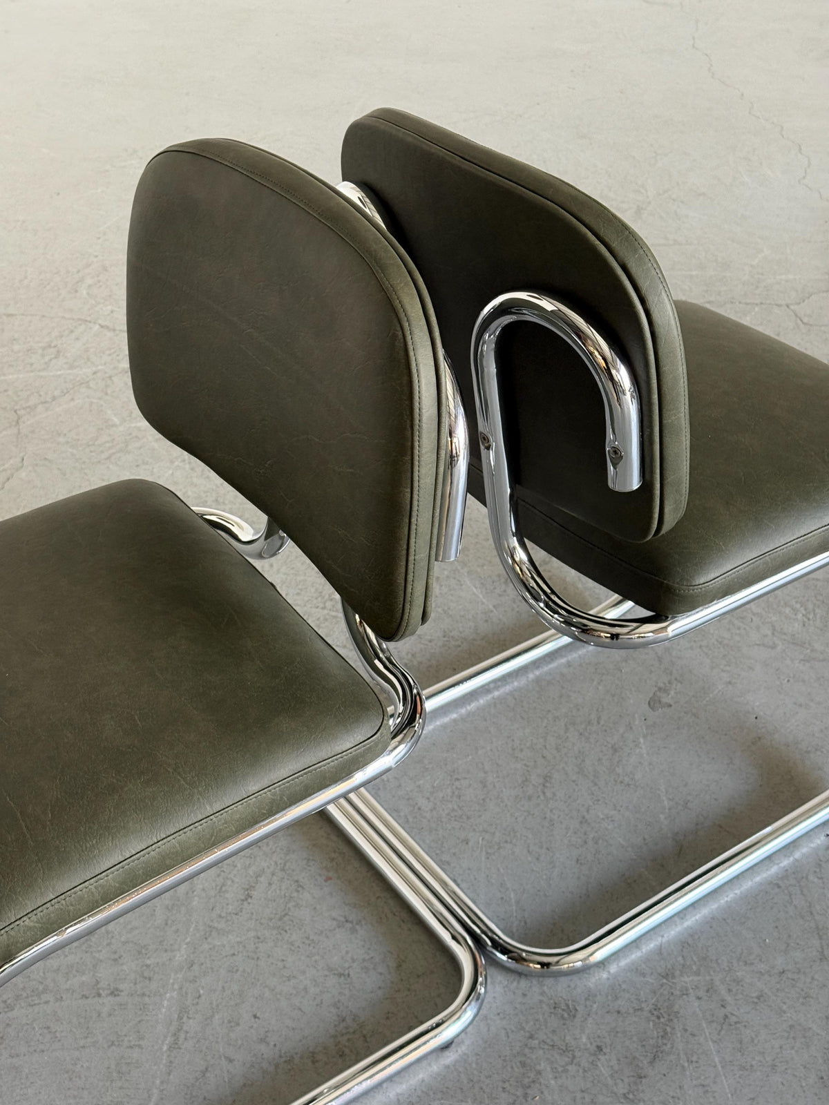 Faded Green Faux Leather Cantilever Chair