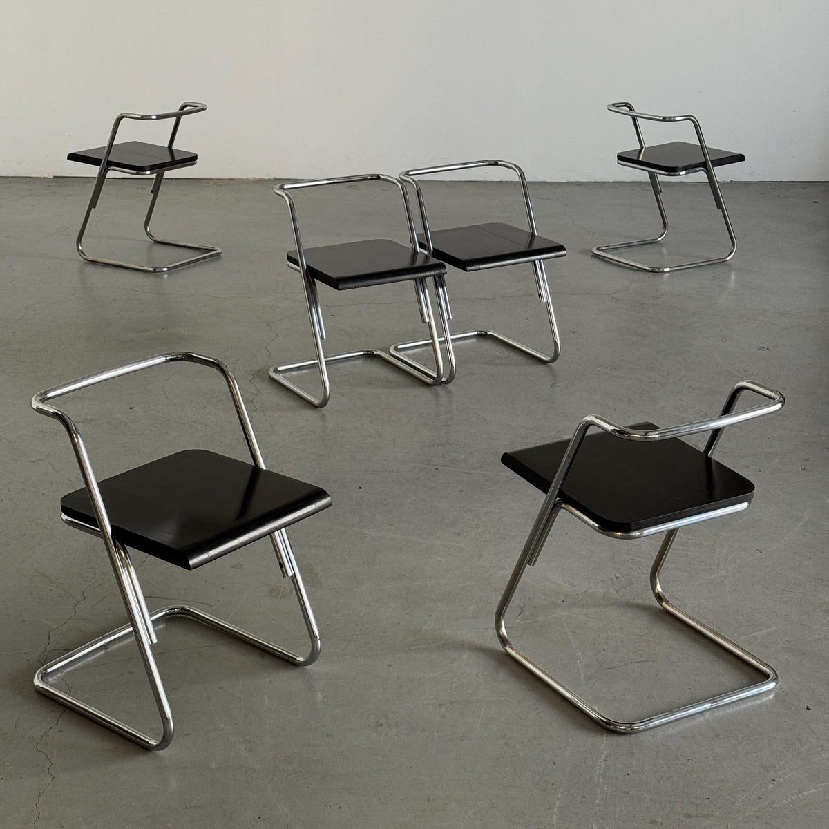 Minimalist Black Wood Cantilever Chairs