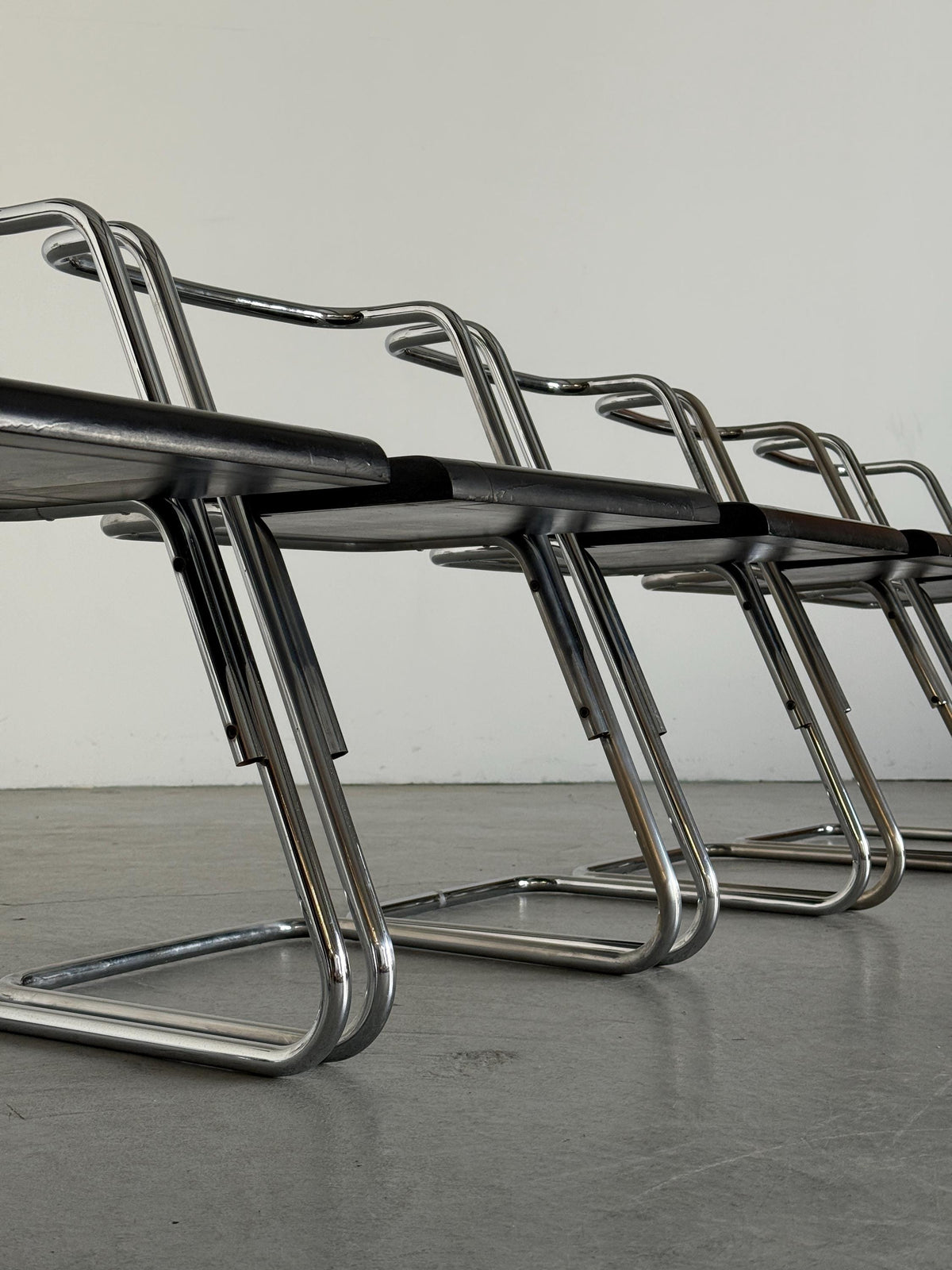 Minimalist Black Wood Cantilever Chairs