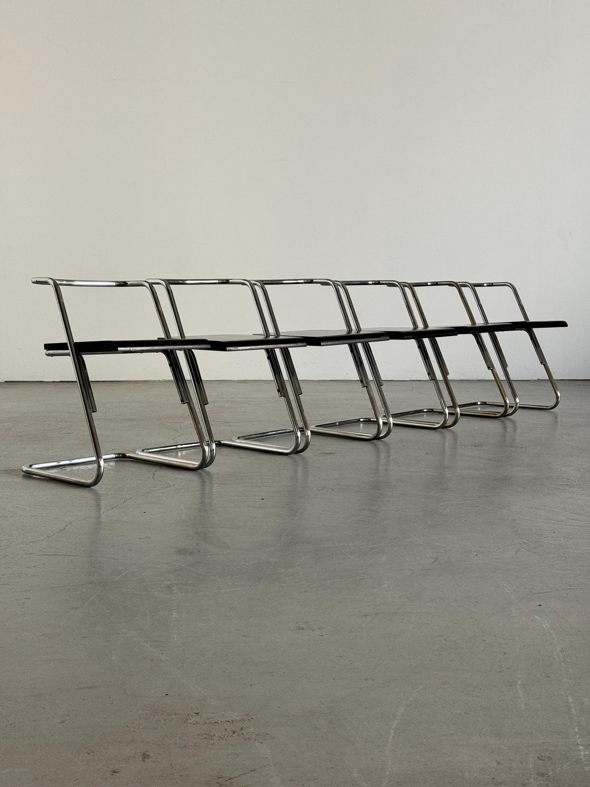 Minimalist Black Wood Cantilever Chairs