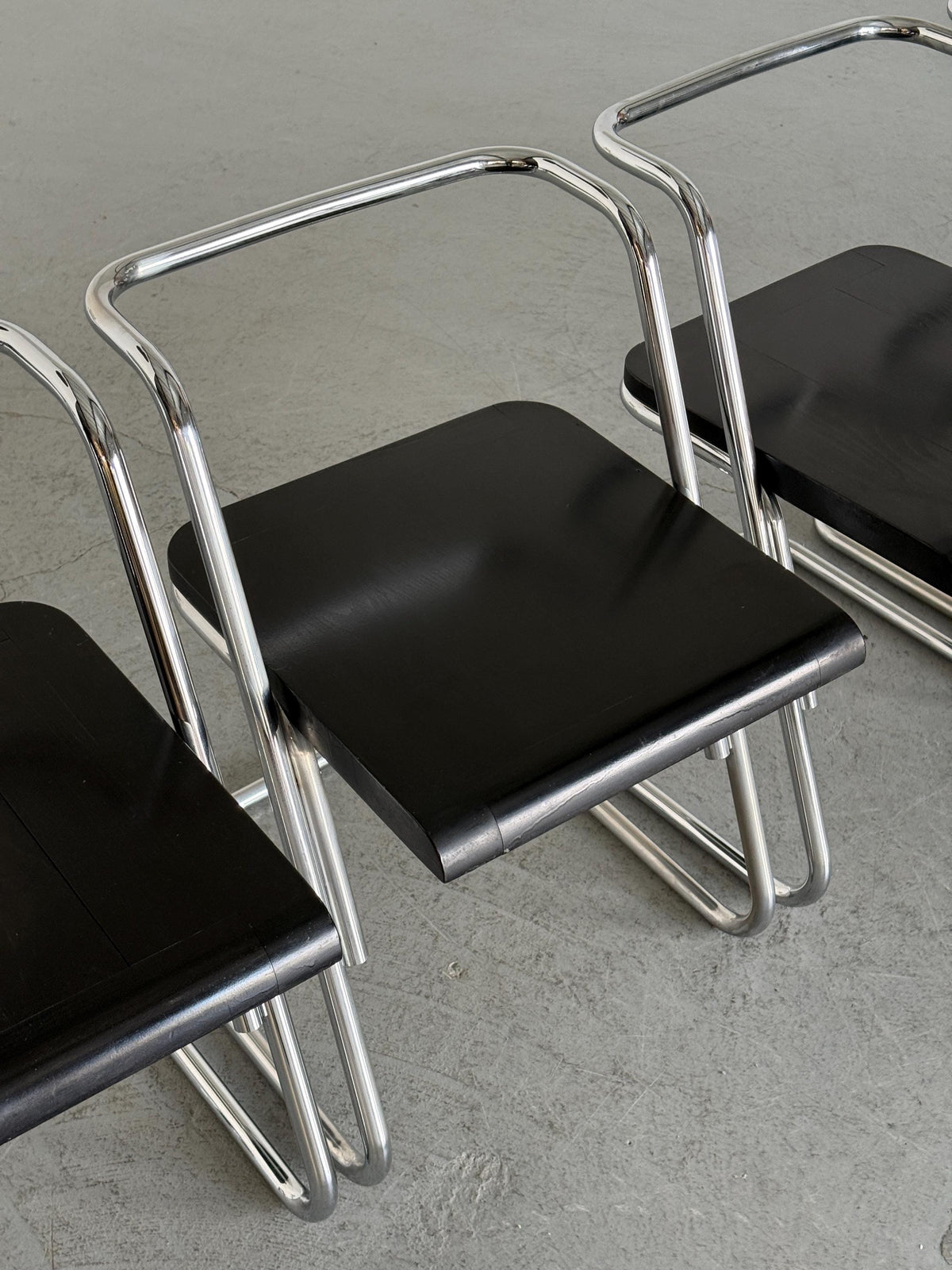 Minimalist Black Wood Cantilever Chairs