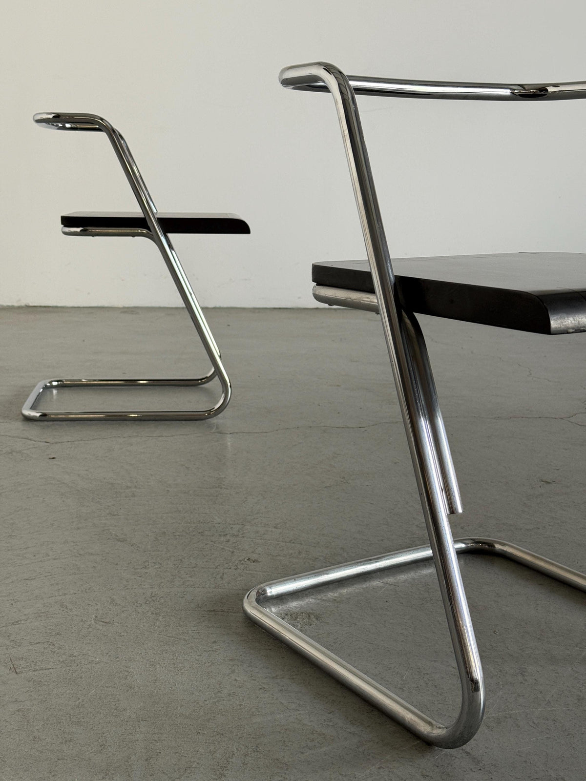 Minimalist Black Wood Cantilever Chairs