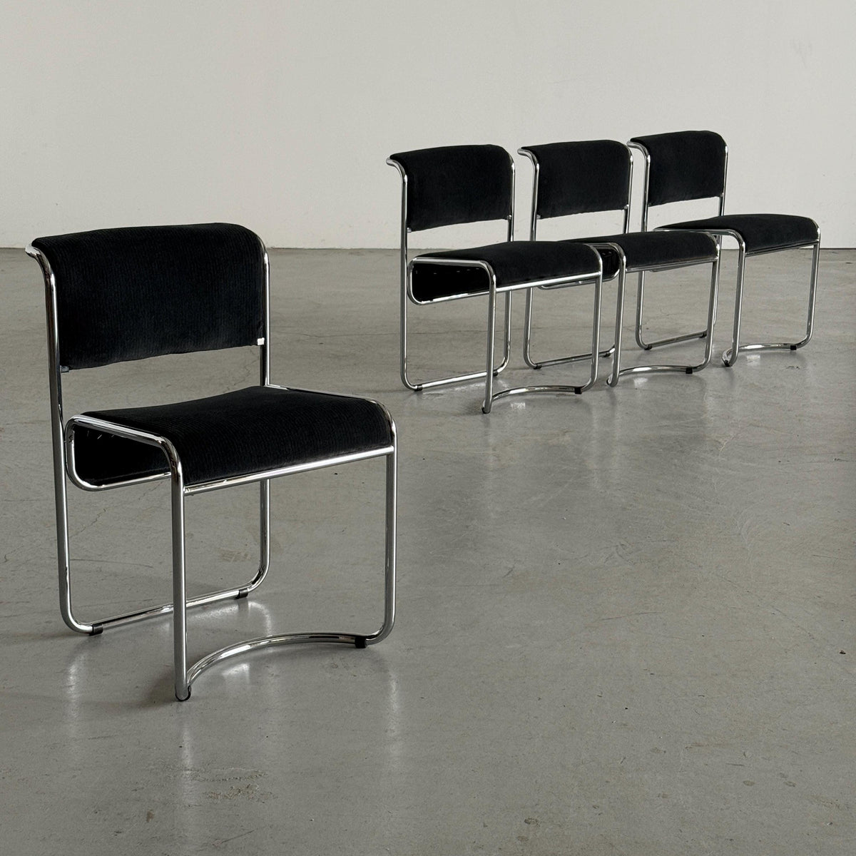 Modernist Black Ribbed and Tubular Chrome Chairs