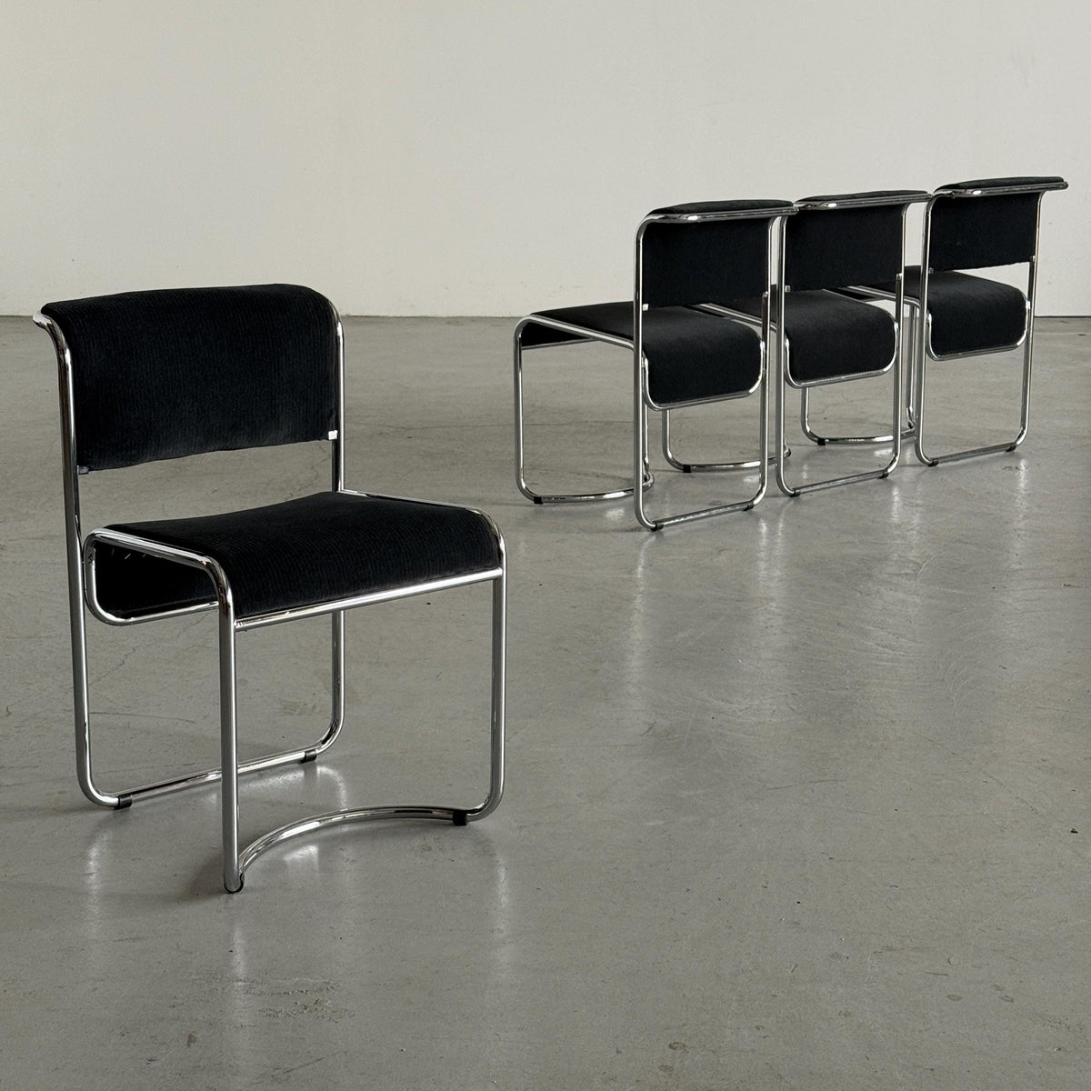 Modernist Black Ribbed and Tubular Chrome Chairs