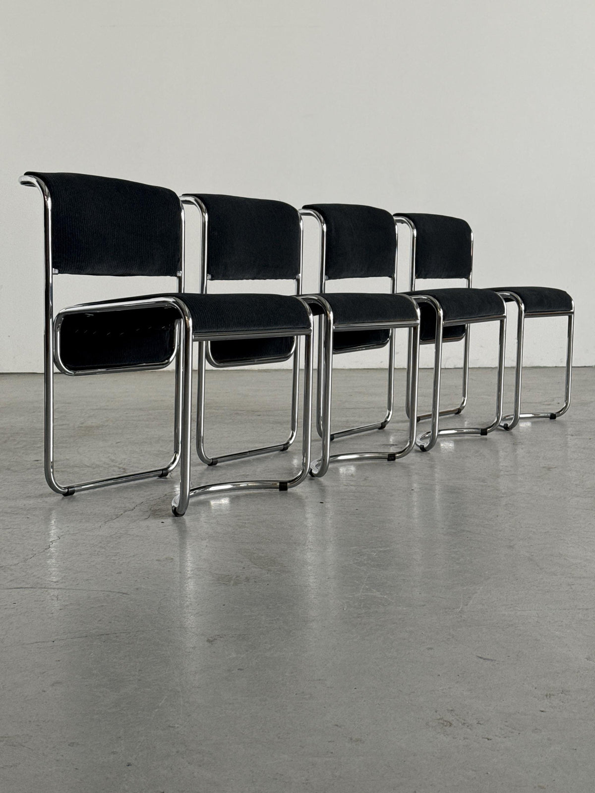 Modernist Black Ribbed and Tubular Chrome Chairs