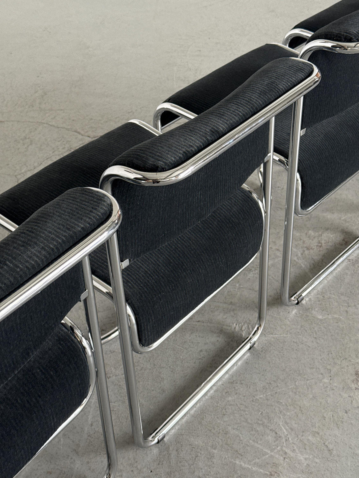 Modernist Black Ribbed and Tubular Chrome Chairs