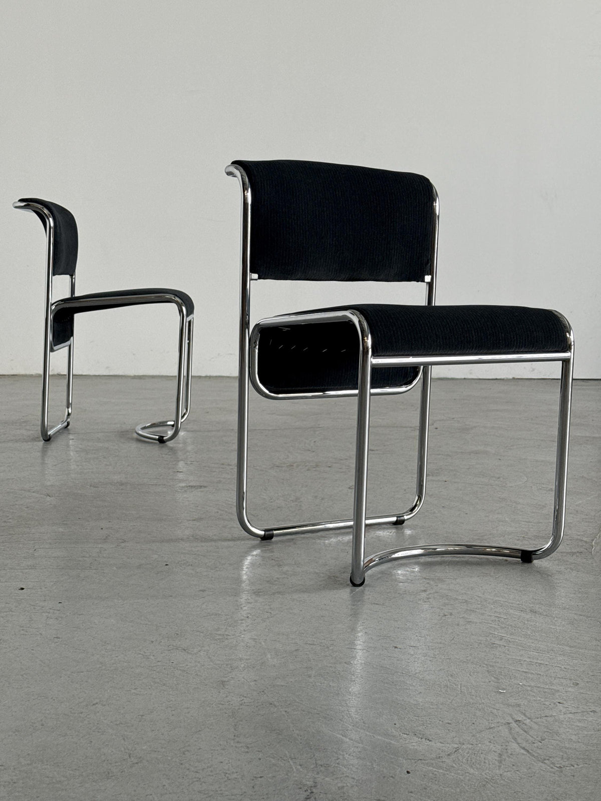 Modernist Black Ribbed and Tubular Chrome Chairs