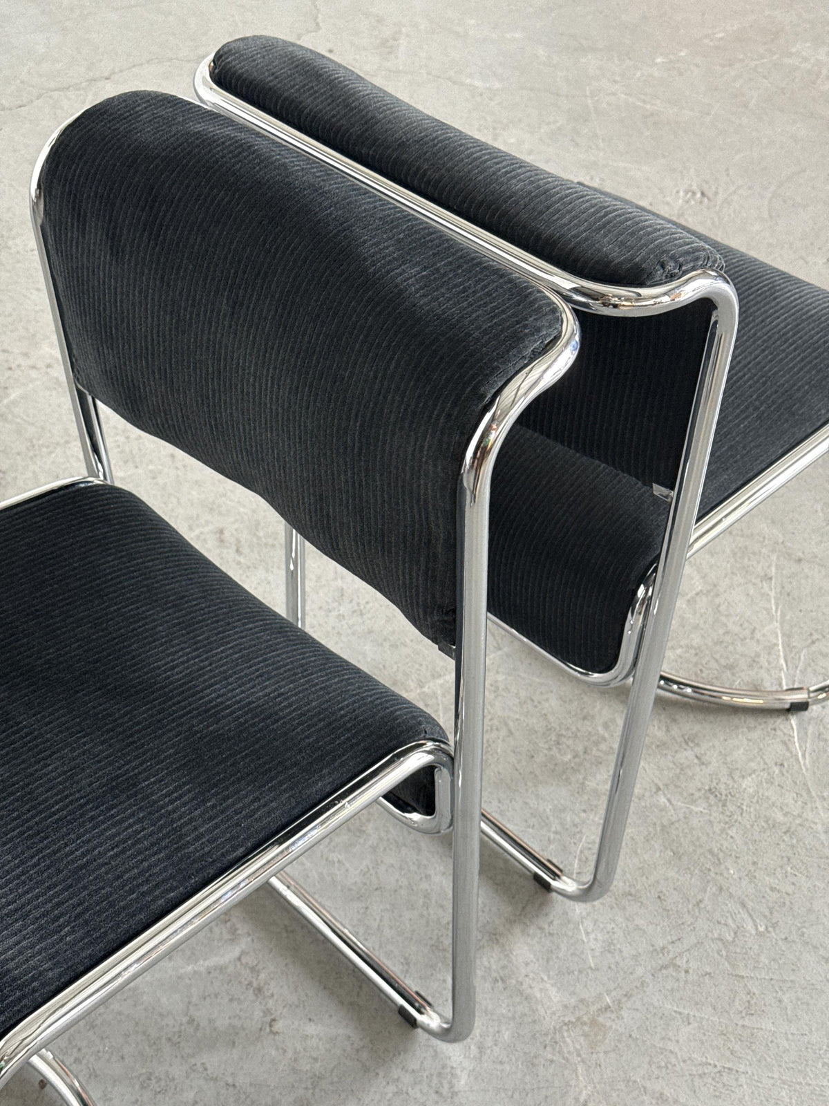 Modernist Black Ribbed and Tubular Chrome Chairs