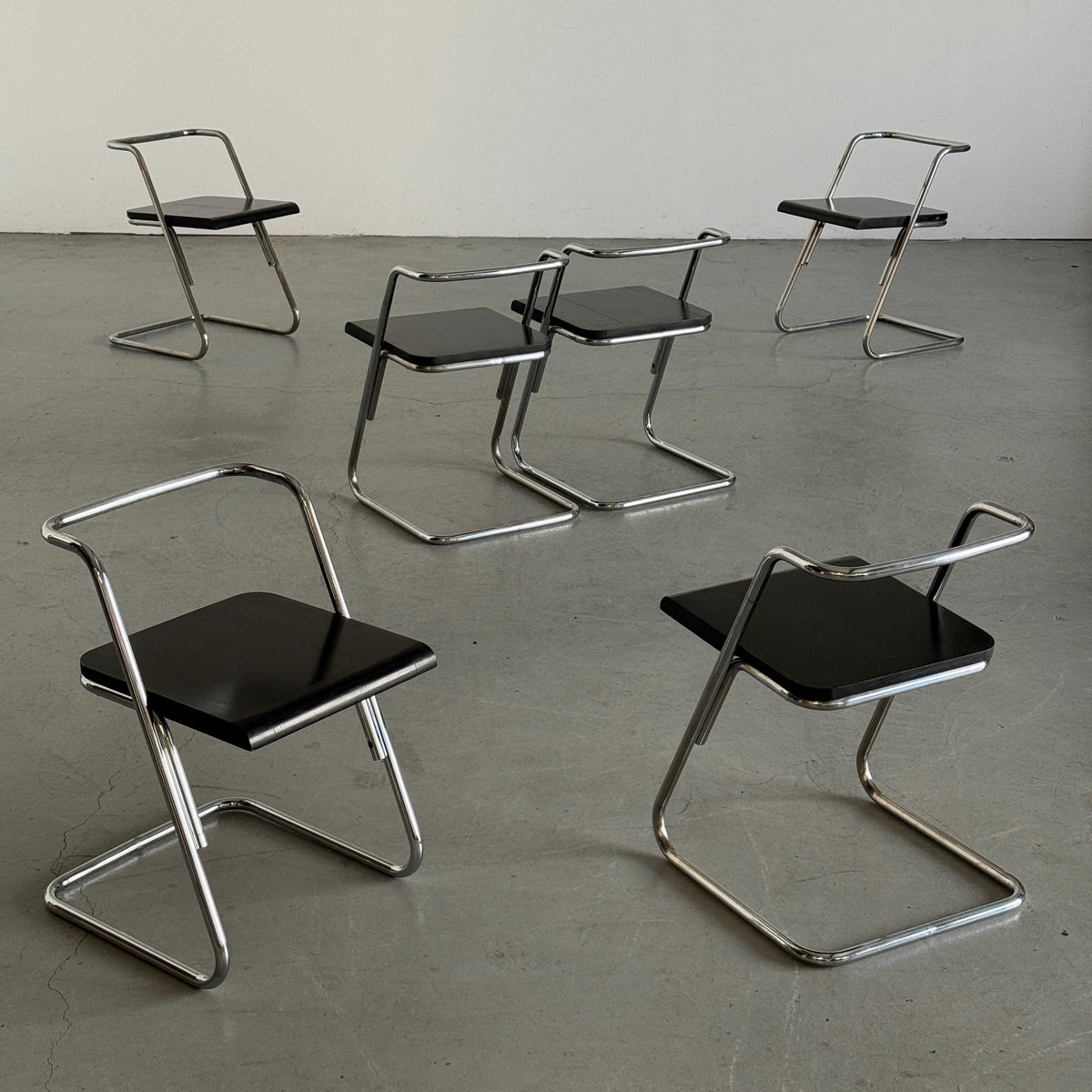 Minimalist Black Wood Cantilever Chairs