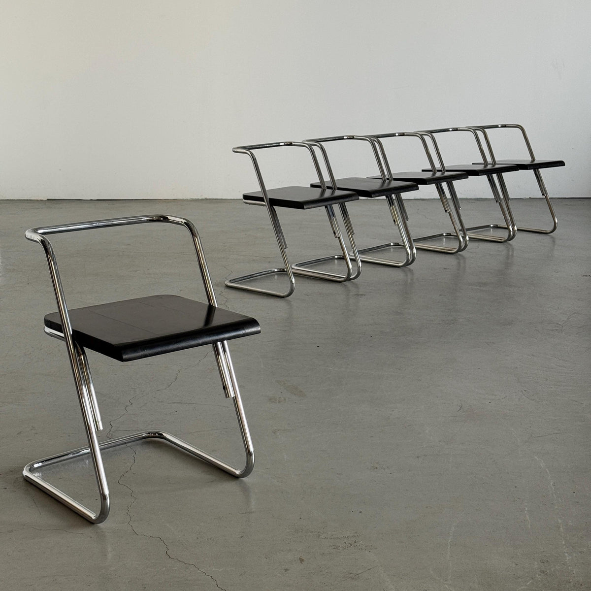 Minimalist Black Wood Cantilever Chairs