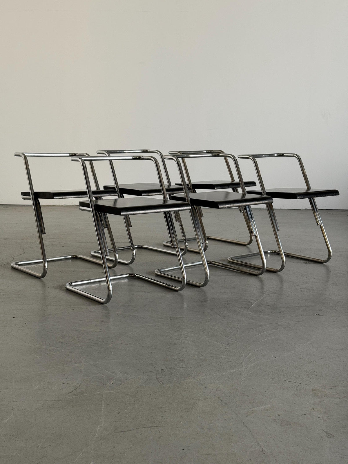 Minimalist Black Wood Cantilever Chairs