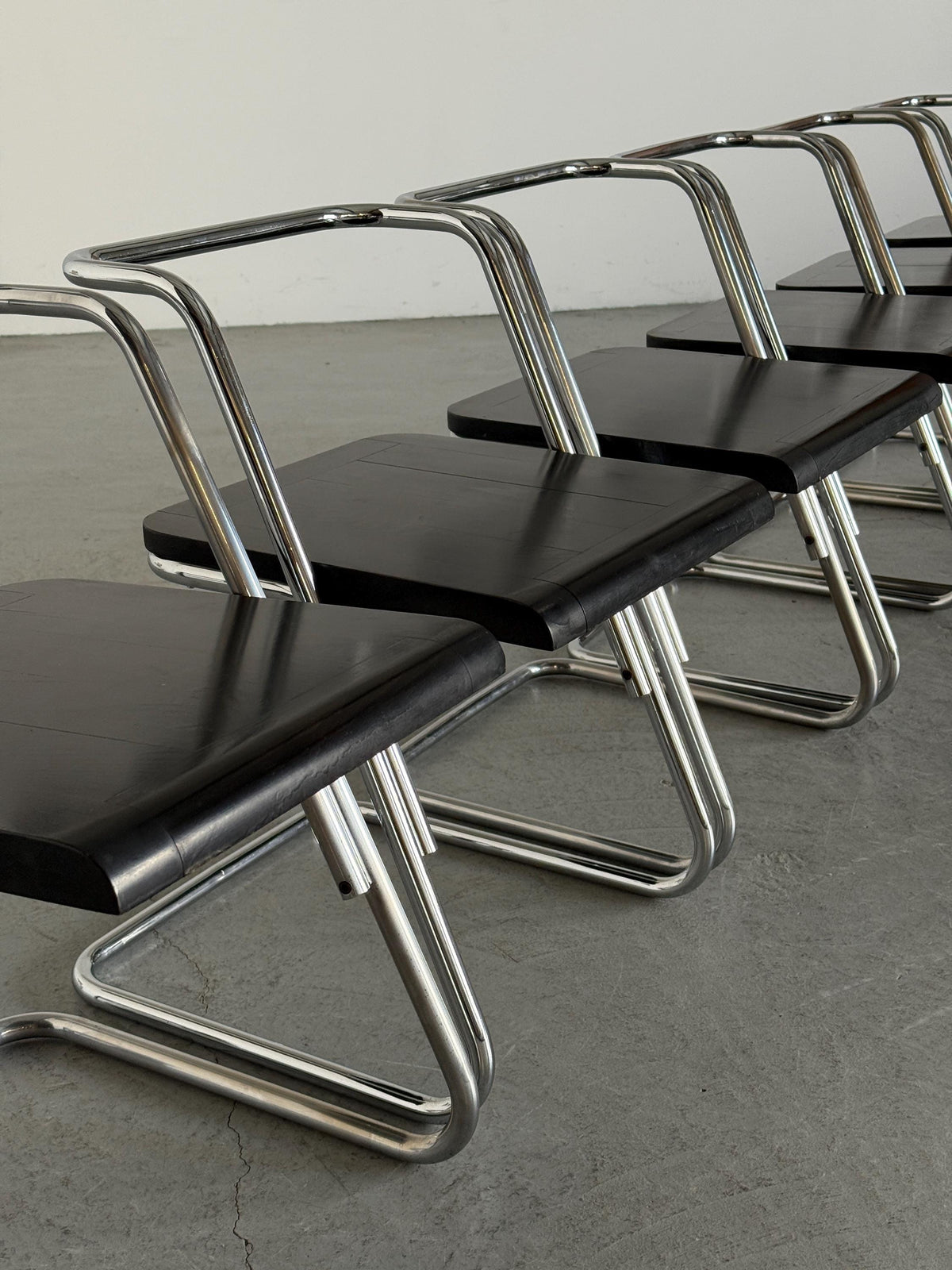 Minimalist Black Wood Cantilever Chairs