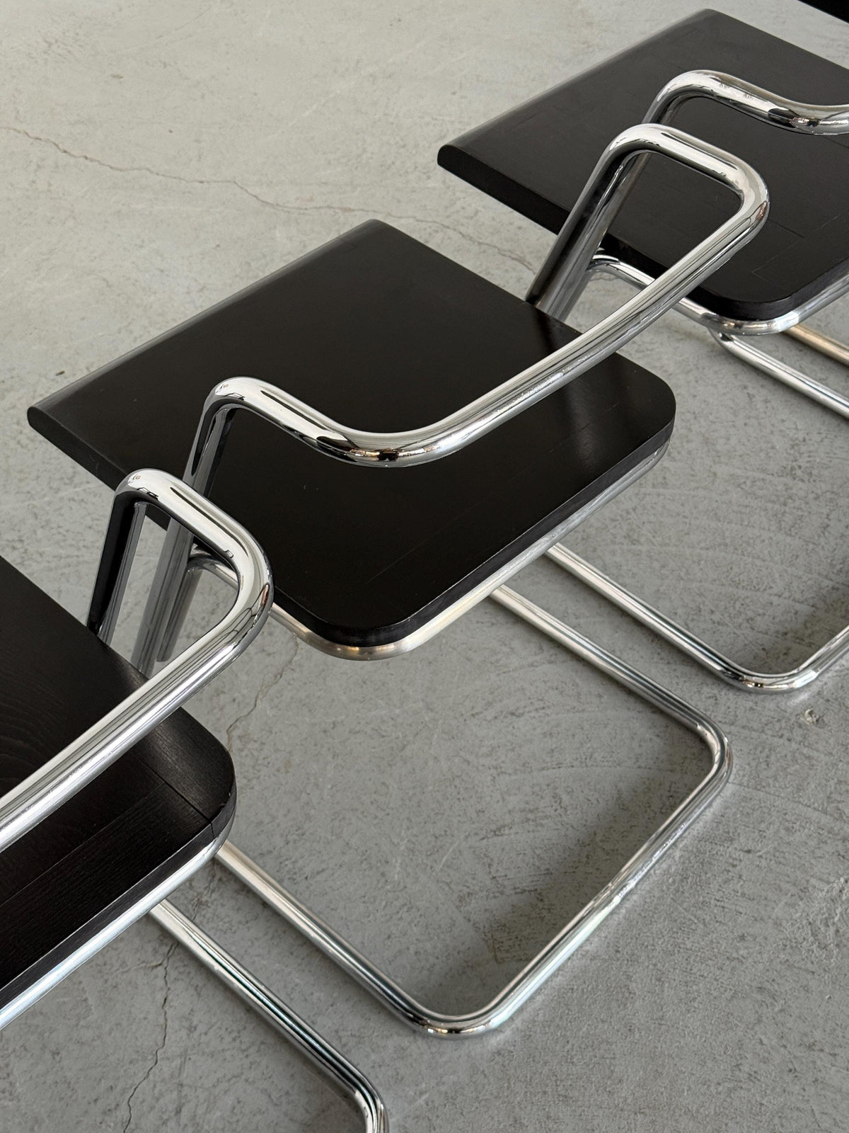 Minimalist Black Wood Cantilever Chairs