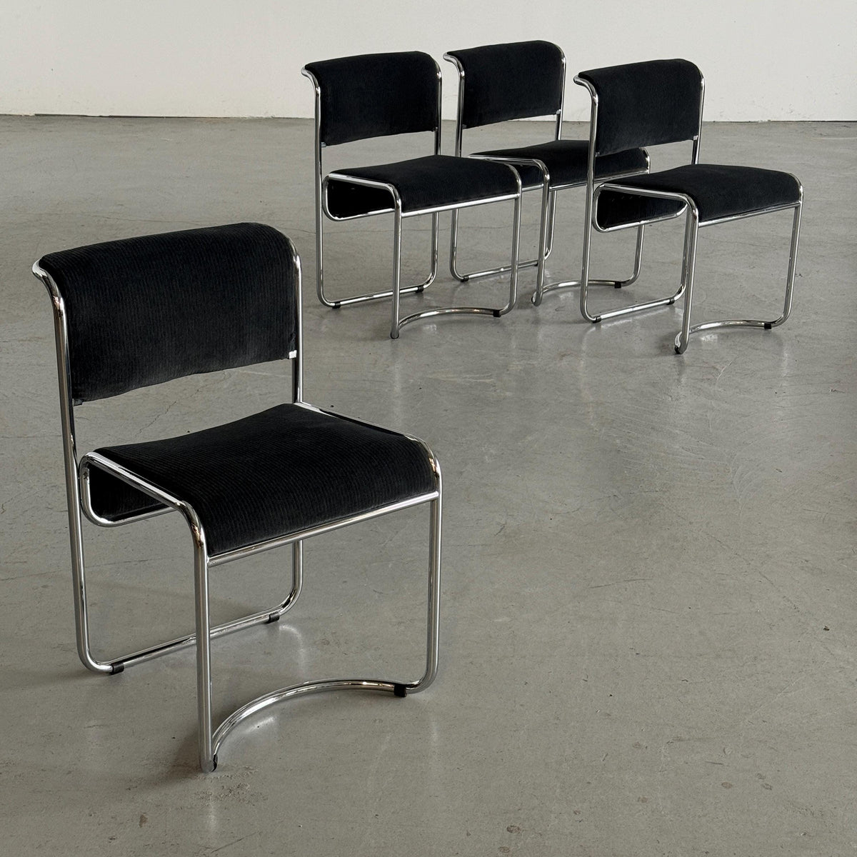Modernist Black Ribbed and Tubular Chrome Chairs