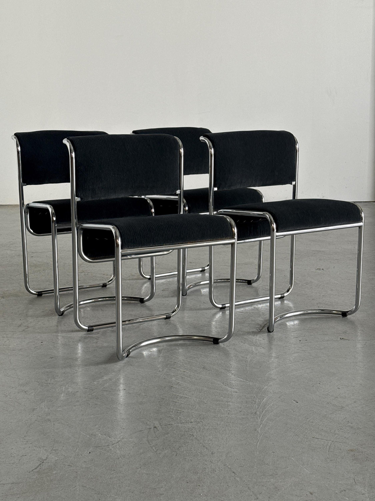 Modernist Black Ribbed and Tubular Chrome Chairs