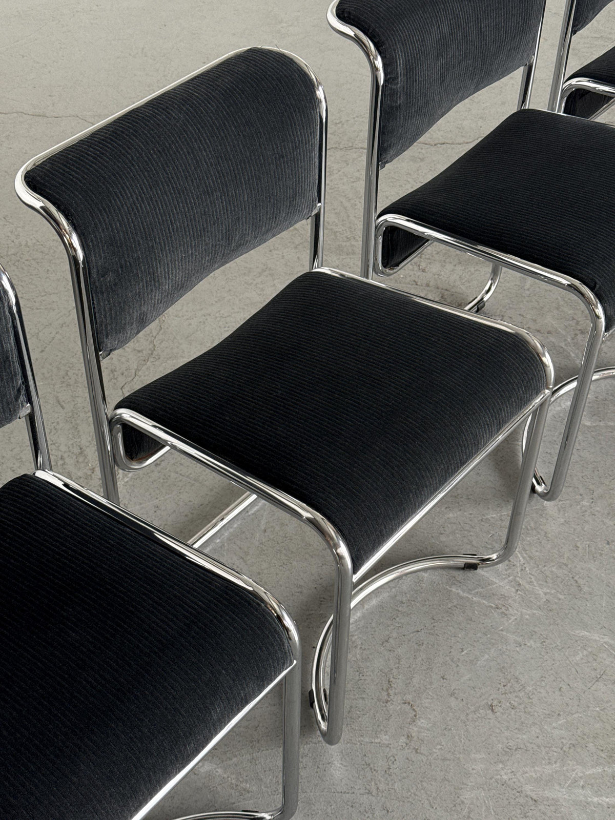 Modernist Black Ribbed and Tubular Chrome Chairs