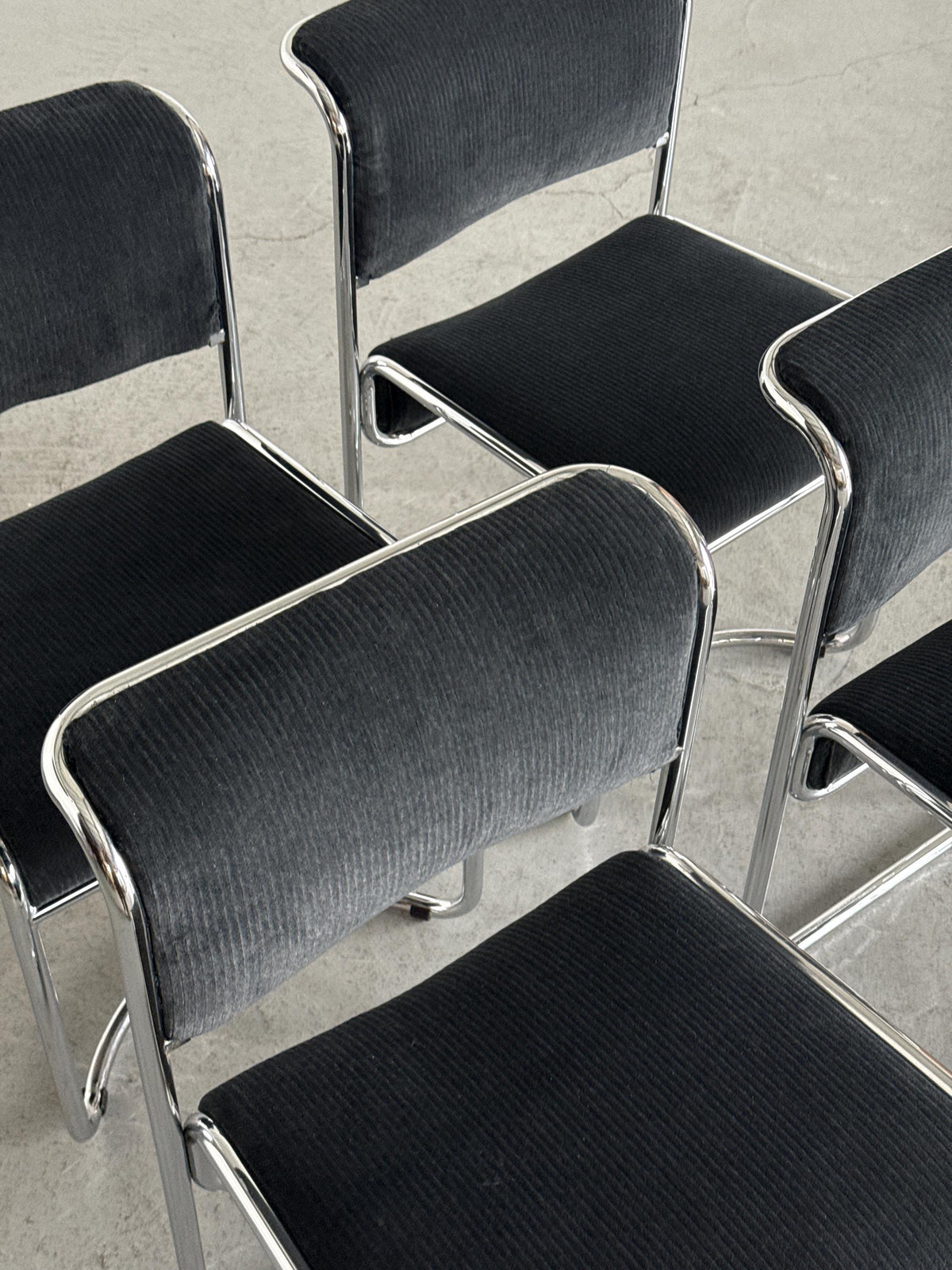 Modernist Black Ribbed and Tubular Chrome Chairs